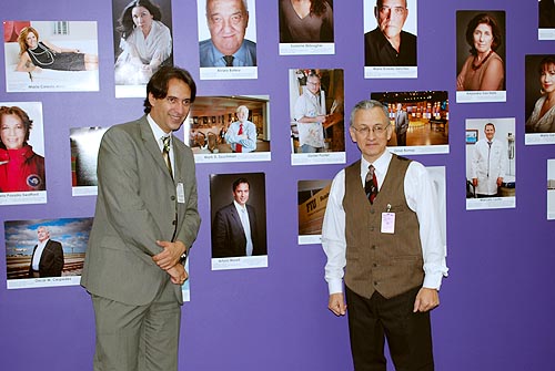 100 Latinos Miami members Arturo Morell, attorney and cultural promoter, and Daniel Pontet, artist and cartoonist, next to their portraits.
