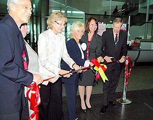 Cutting the ribbon for the first flight are: Marcello Korner, Air Berlin Deputy Station Manager, Miami; Maria Portuondo, Air Berlin Area Manager, North America; Consul General of the Federal Republic of Germany, Eva Alexandra Countess Kendeffy; Kristina M. Harmon, Air Berlin Sales Manager, Southeast USA; Nelly Castaneda, Air Berlin Regional Station Manager for Miami and Fort Myers; and Ken Pyatt, MDAD Deputy Director of Operations.